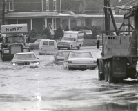 Cars slog through flood waters on Spera Drive, near Gettysburg Road, in Lower Allen Township.